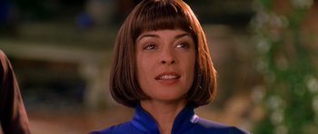Movie still from “What Dreams May Come” (1998), directed by Vincent Ward – A woman that is wearing a blue shirt; Close Up shot, Low angle
