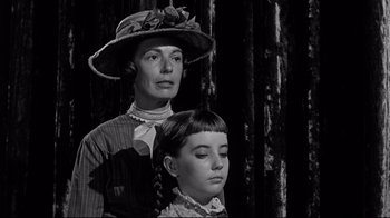 Movie still from “What Ever Happened to Baby Jane?” (1962), directed by Robert Aldrich – An older woman standing next to a young girl; Close Up shot, Over the shoulder angle