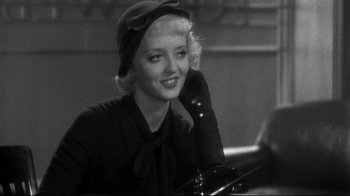 Movie still from “What Ever Happened to Baby Jane?” (1962), directed by Robert Aldrich – A black and white photo of a woman talking on a phone; Close Up shot, Over the shoulder angle