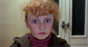 Movie still from “What Have I Done to Deserve This?” (1984), directed by Pedro Almodóvar – A young girl's eyes and hair; Close Up shot, High angle