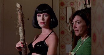 Movie still from “What Have I Done to Deserve This?” (1984), directed by Pedro Almodóvar – A woman in a black dress and a woman in a black wig; Close Up shot, Low angle