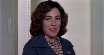 Movie still from “What Have I Done to Deserve This?” (1984), directed by Pedro Almodóvar – A person wearing a jacket; Close Up shot, High angle