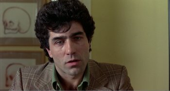 Movie still from “What Have I Done to Deserve This?” (1984), directed by Pedro Almodóvar – A person wearing a jacket; Close Up shot, Low angle