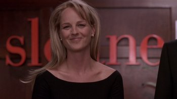 Movie still from “What Women Want” (2000), directed by Nancy Meyers – A woman in a black shirt smiling for the camera; Close Up shot, Low angle