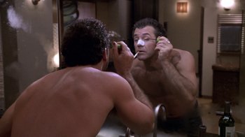 Movie still from “What Women Want” (2000), directed by Nancy Meyers – A man shaving in front of a bathroom mirror; Close Up shot, Over the shoulder angle