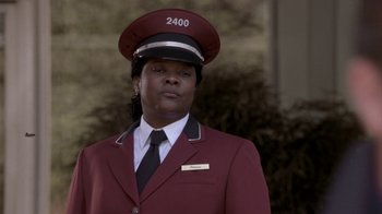 Movie still from “What Women Want” (2000), directed by Nancy Meyers – A woman in a red jacket and a red hat; Close Up shot, Low angle