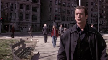 Movie still from “What Women Want” (2000), directed by Nancy Meyers – A group of people walking down a street; Medium shot, Over the shoulder angle