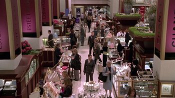 Movie still from “What Women Want” (2000), directed by Nancy Meyers – A group of people walking through a store; Extreme Wide shot, High angle