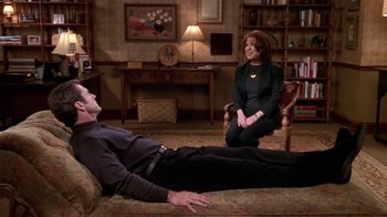 Movie still from “What Women Want” (2000), directed by Nancy Meyers – A man laying on the ground next to a woman in a room; Wide shot, High angle