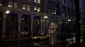Movie still from “What Women Want” (2000), directed by Nancy Meyers – A taxi cab driving down the street at night; Extreme Wide shot, High angle