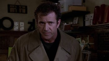 Movie still from “What Women Want” (2000), directed by Nancy Meyers – A person wearing a jacket; Close Up shot, Over the shoulder angle