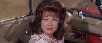 Movie still from “What a Way to Go!” (1964), directed by J. Lee Thompson – A person wearing a headband; Close Up shot, Low angle