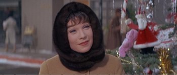 Movie still from “What a Way to Go!” (1964), directed by J. Lee Thompson – A person wearing a coat and a fur hat; Close Up shot, Low angle
