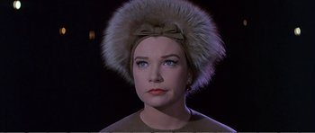 Movie still from “What a Way to Go!” (1964), directed by J. Lee Thompson – A person wearing a hat with a bow; Close Up shot, Low angle