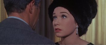 Movie still from “What a Way to Go!” (1964), directed by J. Lee Thompson – A woman's face and a man's face; Close Up shot, Over the shoulder angle