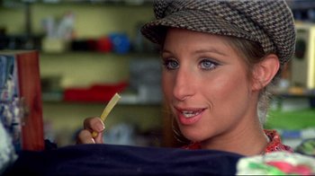 Movie still from “What's Up, Doc?” (1972), directed by Peter Bogdanovich – A woman in a hat is holding a tooth brush; Close Up shot, Over the shoulder angle