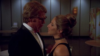 Movie still from “What's Up, Doc?” (1972), directed by Peter Bogdanovich – A man and a woman in formal wear looking at one another; Close Up shot, Over the shoulder angle
