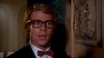 Movie still from “What's Up, Doc?” (1972), directed by Peter Bogdanovich – A man wearing a suit and bow tie; Close Up shot, Low angle