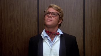 Movie still from “What's Up, Doc?” (1972), directed by Peter Bogdanovich – A man wearing a suit and a bow tie; Close Up shot, Low angle