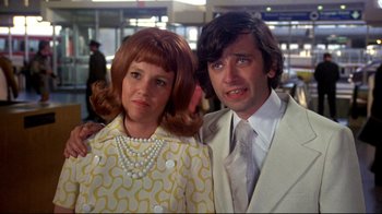 Movie still from “What's Up, Doc?” (1972), directed by Peter Bogdanovich – A man and a woman dressed up in costume; Close Up shot, Low angle