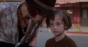 Movie still from “What's the Matter with Helen?” (1971), directed by Curtis Harrington – A woman and a child looking at each other; Close Up shot, Over the shoulder angle