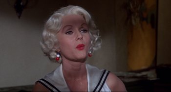 Movie still from “What's the Matter with Helen?” (1971), directed by Curtis Harrington – A person wearing a sailor suit; Close Up shot, Low angle