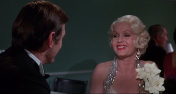 Movie still from “What's the Matter with Helen?” (1971), directed by Curtis Harrington – A man and a woman are talking to each other; Close Up shot, Over the shoulder angle