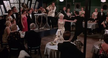 Movie still from “What's the Matter with Helen?” (1971), directed by Curtis Harrington – A group of people dancing in a room; Wide shot, High angle