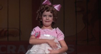 Movie still from “What's the Matter with Helen?” (1971), directed by Curtis Harrington – A little girl in a pink and white dress; Close Up shot, Low angle