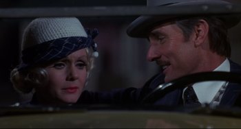 Movie still from “What's the Matter with Helen?” (1971), directed by Curtis Harrington – An older man and a younger woman in a car looking at each other; Close Up shot, Over the shoulder angle