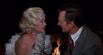 Movie still from “What's the Matter with Helen?” (1971), directed by Curtis Harrington – A man and a woman are looking at one another; Close Up shot, Over the shoulder angle
