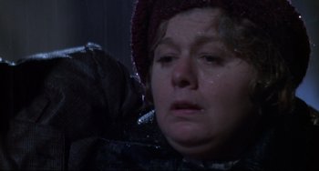 Movie still from “What's the Matter with Helen?” (1971), directed by Curtis Harrington – A person crying in the rain; Close Up shot, Over the shoulder angle