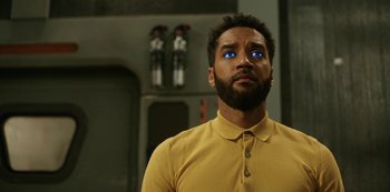 Movie still from “Another Life” (2019), created by Aaron Martin – A man with blue eyes looking up at the sky; Close Up shot, Low angle