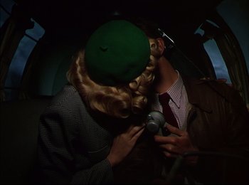 Movie still from “When Worlds Collide” (1951), directed by Rudolph Maté – A man and a woman kissing in the dark; Close Up shot, Overhead angle
