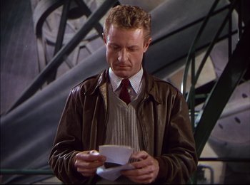 Movie still from “When Worlds Collide” (1951), directed by Rudolph Maté – A man in a brown jacket and a red neck tie; Medium shot, Low angle