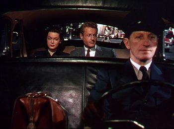 Movie still from “When Worlds Collide” (1951), directed by Rudolph Maté – A group of people sitting in the back of a car; Medium shot, Low angle