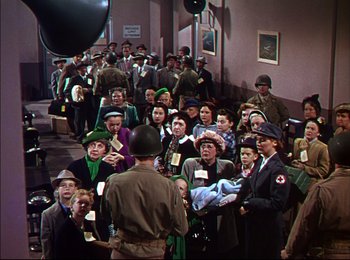 Movie still from “When Worlds Collide” (1951), directed by Rudolph Maté – A group of people standing in a room; Wide shot, High angle