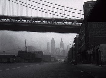 Movie still from “When Worlds Collide” (1951), directed by Rudolph Maté – A black - and - white photo of a bridge and buildings; Extreme Wide shot, Low angle