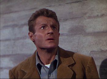 Movie still from “When Worlds Collide” (1951), directed by Rudolph Maté – A person wearing a suit and tie; Close Up shot, Low angle