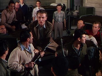Movie still from “When Worlds Collide” (1951), directed by Rudolph Maté – A group of men standing in a room holding guns; Medium shot, Over the shoulder angle