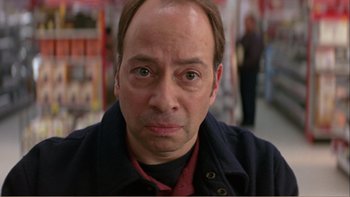 Movie still from “When a Man Falls” (2007), directed by Ryan Eslinger – A person wearing a jacket; Close Up shot, High angle