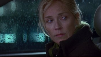 Movie still from “When a Man Falls” (2007), directed by Ryan Eslinger – A person looking out of a car window; Close Up shot, Over the shoulder angle