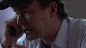 Movie still from “When a Man Falls” (2007), directed by Ryan Eslinger – A person wearing a hat; Close Up shot, Low angle