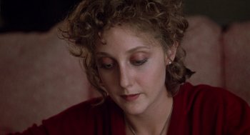 Movie still from “When a Stranger Calls” (1979), directed by Fred Walton – A person with curly hair; Close Up shot, High angle