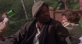 Movie still from “When a Stranger Calls” (1979), directed by Fred Walton – A person wearing a hat and a coat; Medium shot, Over the shoulder angle