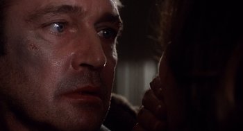 Movie still from “When a Stranger Calls” (1979), directed by Fred Walton – A man's eyes and face; Close Up shot, Over the shoulder angle