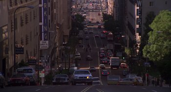 Movie still from “When a Stranger Calls” (1979), directed by Fred Walton – A city street filled with lots of traffic at night; Extreme Wide shot, High angle
