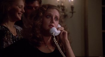 Movie still from “When a Stranger Calls” (1979), directed by Fred Walton – A woman holding a phone up to her ear; Close Up shot, Low angle