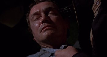 Movie still from “When a Stranger Calls” (1979), directed by Fred Walton – A person with his eyes closed; Close Up shot, High angle