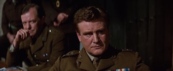 Movie still from “Where Eagles Dare” (1968), directed by Brian G. Hutton – A person wearing a military uniform; Close Up shot, Low angle